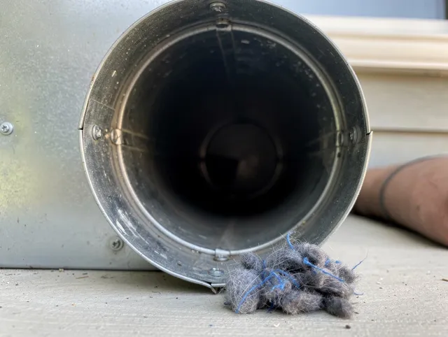 La Habra Dryer Vent Cleaning technician using specialized equipment to clear severe dryer vent blockage in La Habra